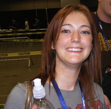 a woman holding a bottle of water