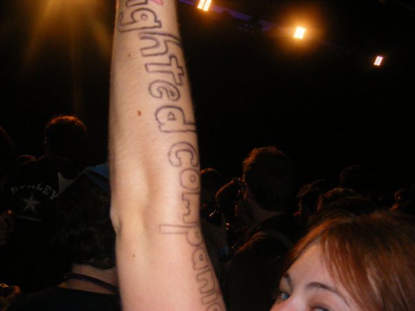 a woman with a tattoo on her arm