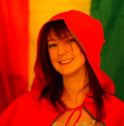 a woman in a red hoodie and a green and yellow background