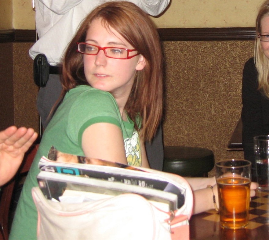 a woman and a girl sitting at a table