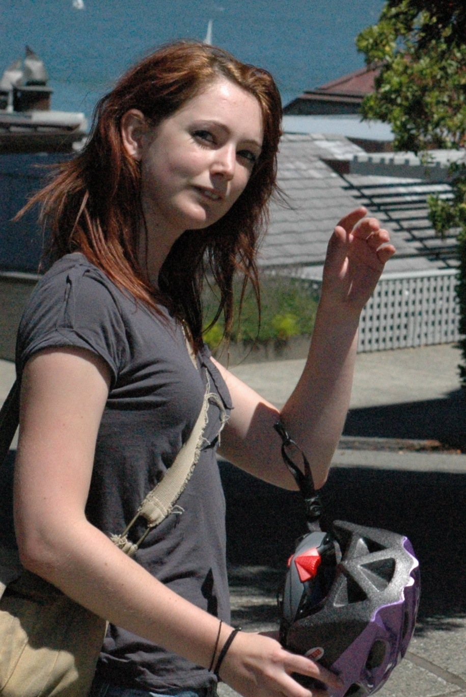 a woman with a backpack and a cellphone