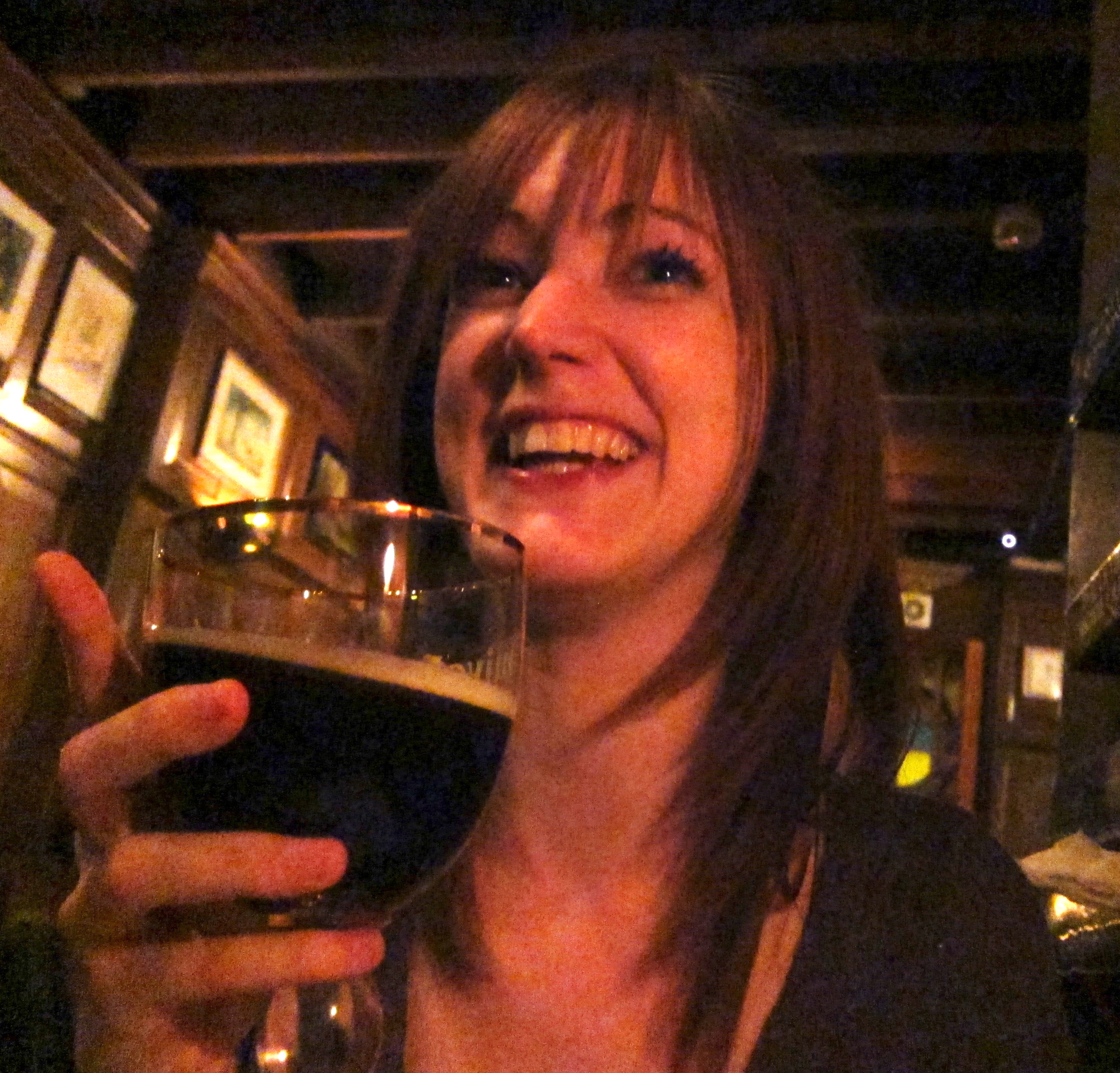 a woman holding a glass of wine