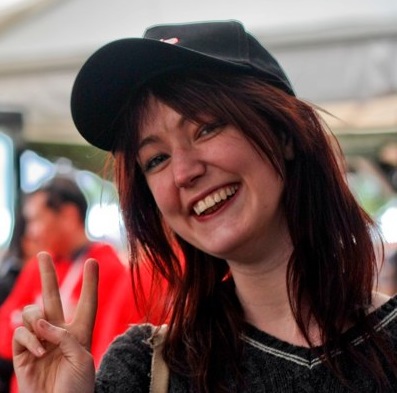 a woman with a hat and a black shirt