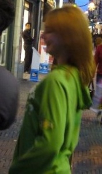 a young girl in a green shirt