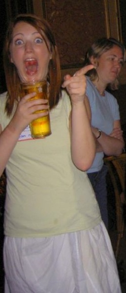 a woman holding a beer glass