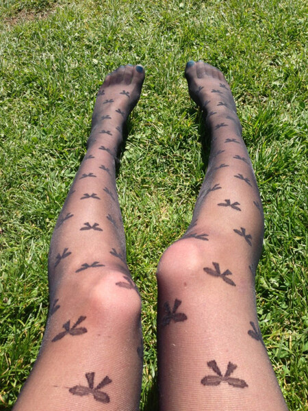 a person with tattoos on their legs