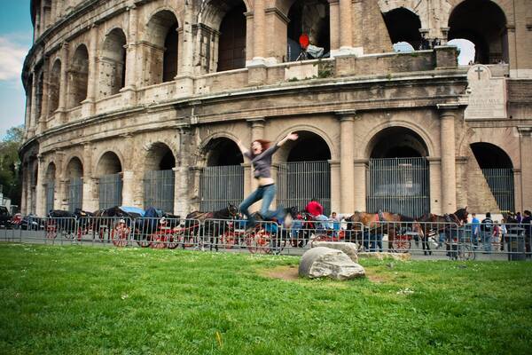 a man is jumping in front of an old building 3 = a, tt .
Pr
eal

“she 3