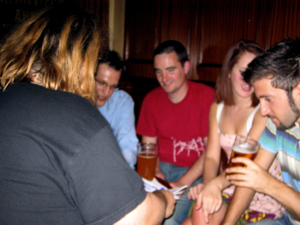 a group of people sitting around a table