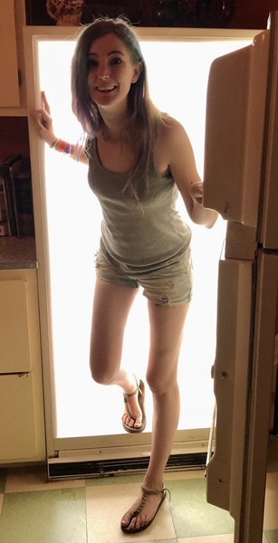 a woman is standing in a doorway