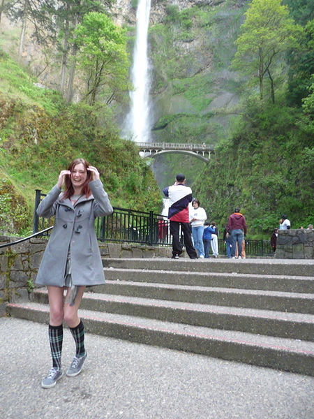 a woman is standing on the steps