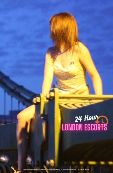 a woman sitting on top of a wooden bench 24 How
LONDON ESCORTS