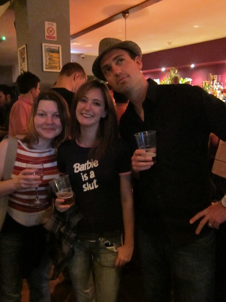 a group of people standing around a bar