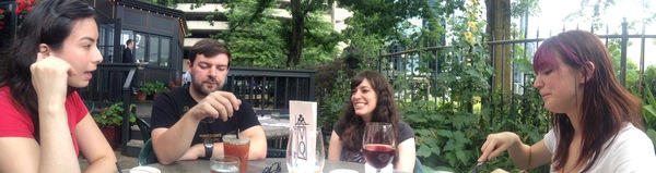 a woman sitting at a table with a man