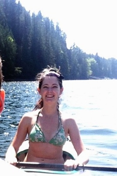 two women in a boat on a lake