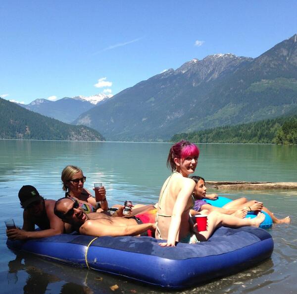 a group of people floating in a lake