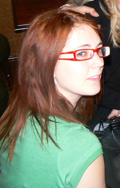 a woman with red glasses