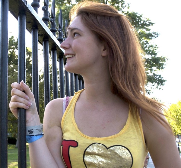 a woman wearing a yellow shirt