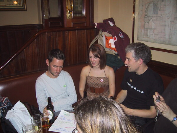 a group of people sitting around a table