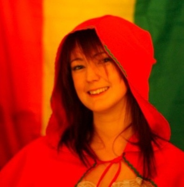 a woman in a red cape with a red hoodie