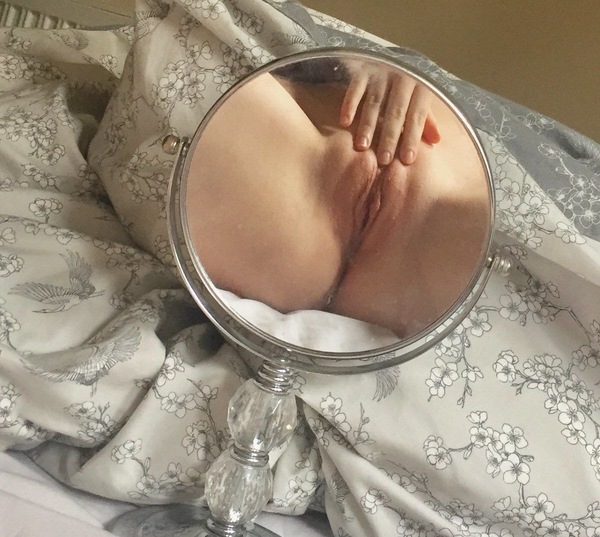 a woman's breasts are shown in a mirror