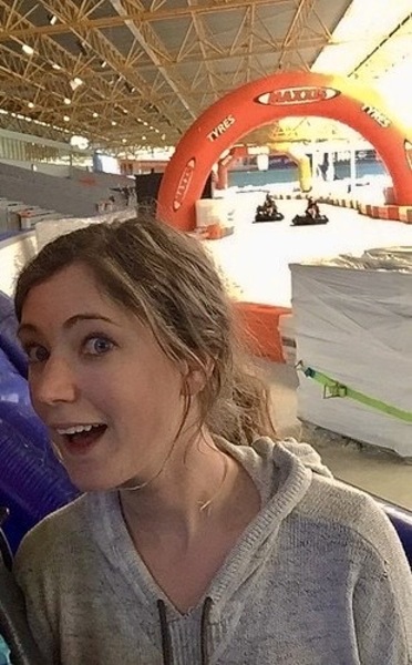 two girls are sitting on a blue and white inflatable