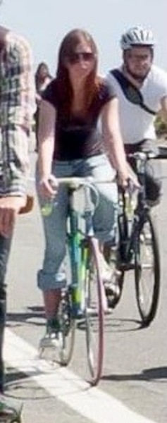 a group of people riding bikes down a street