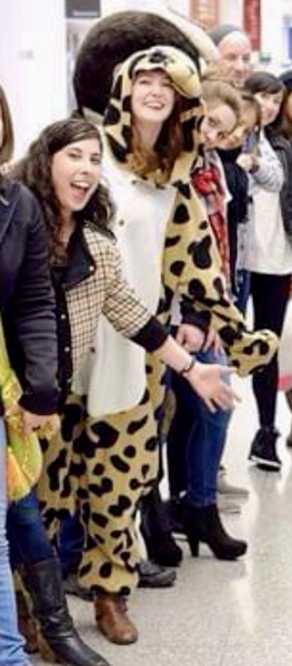 children in animal costumes at the airport