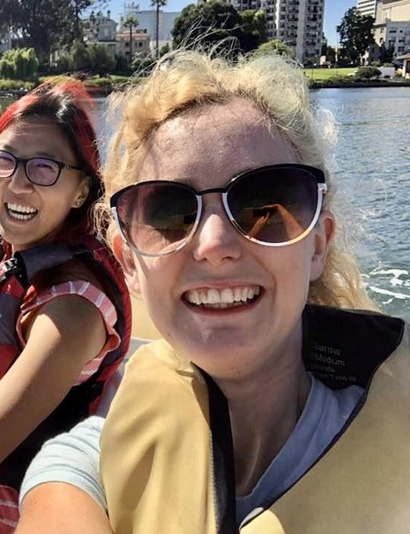 two women in a boat on a lake