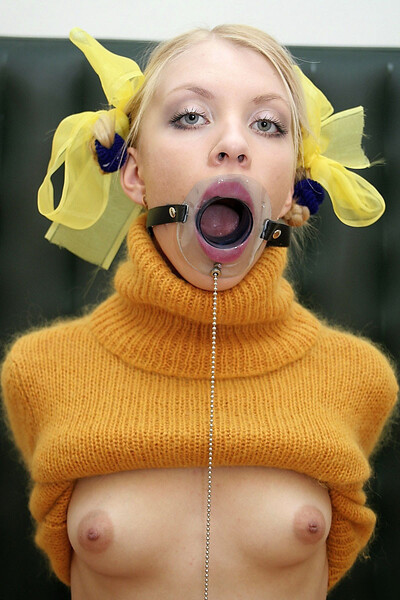 a woman with a yellow sweater and a yellow flower in her hair