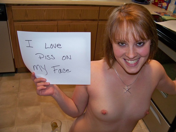 a woman holding a sign that says i love you