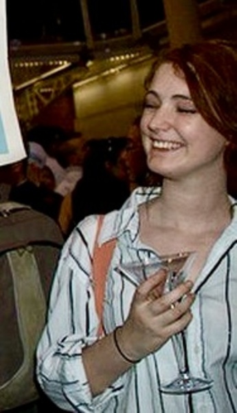 a woman holding a sign that says no to the people