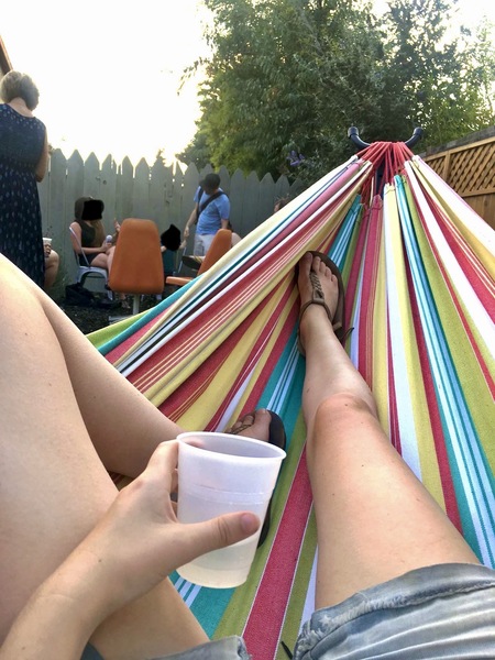 a person laying in a hammock on a hammock