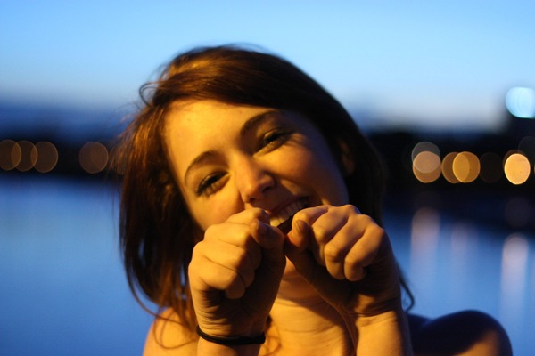 a woman is holding a piece of food