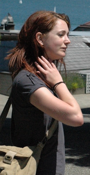 a woman with a backpack on her shoulder