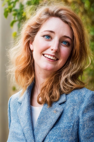 a woman with blonde hair and blue eyes