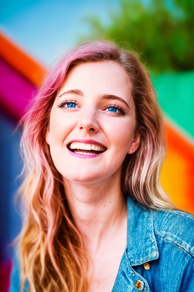 a woman with long blonde hair and blue eyes