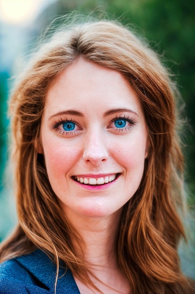 a woman with long hair and blue eyes