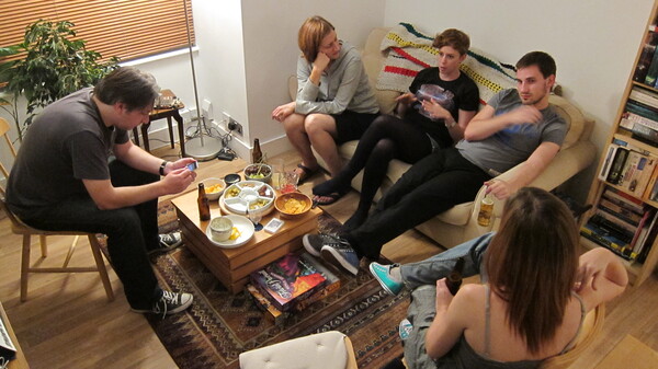 a group of people sitting around a coffee table