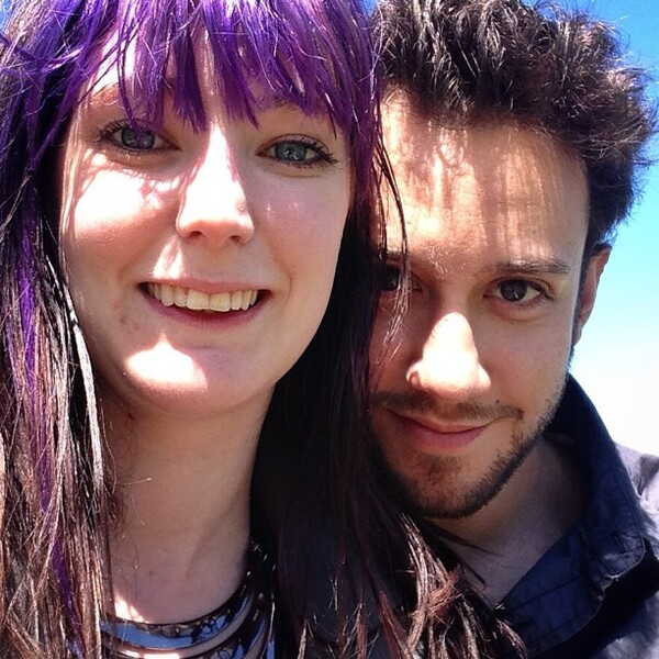 a man and woman with purple hair