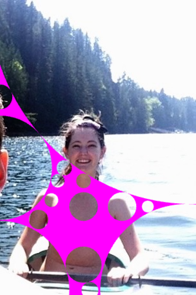 two girls in a boat with a pink star on the side