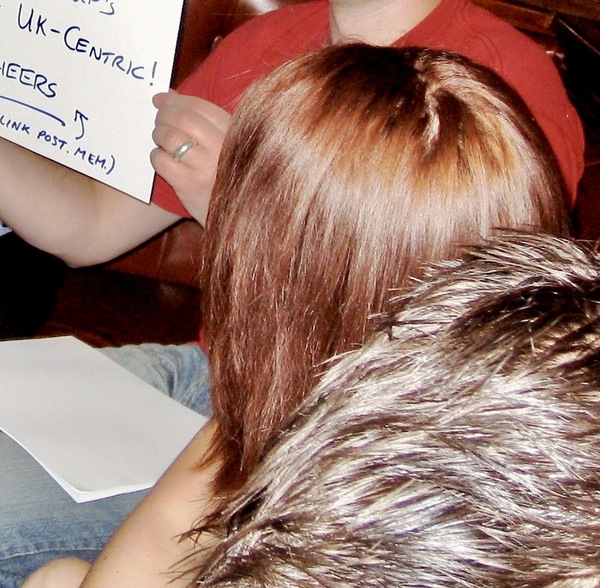 a woman holding a sign