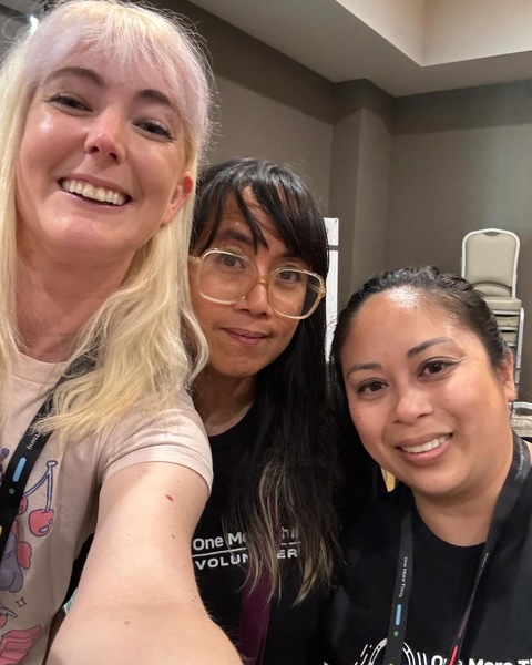 two women smiling and taking a selfie