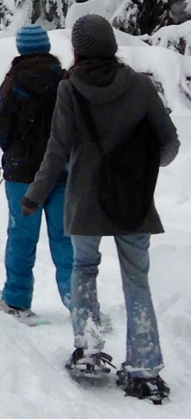 two people are snowboardinging in the snow