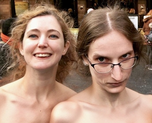 two women are posing for the camera