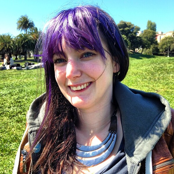 a woman with purple hair and a brown jacket