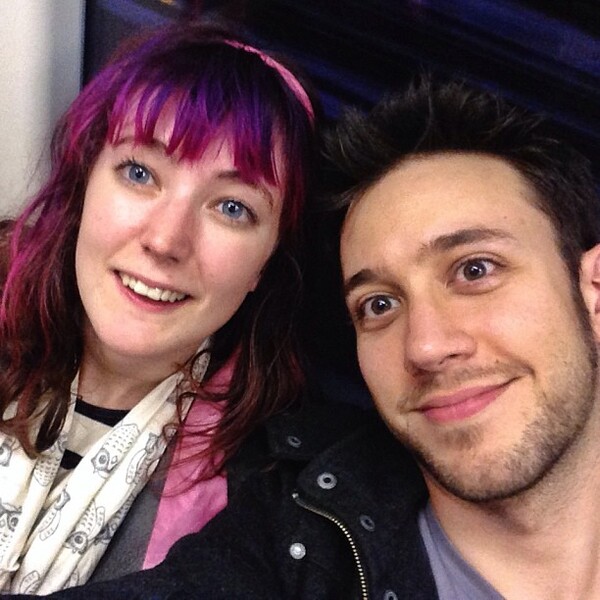 a man and woman are posing for a photo