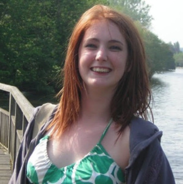 a woman standing on a bridge