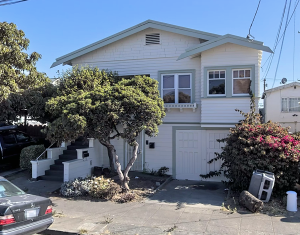 a house with a car parked in front of it