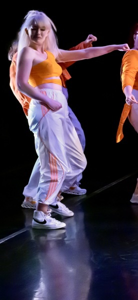 two people in a dance pose on a stage