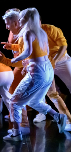 a group of people dancing on a stage